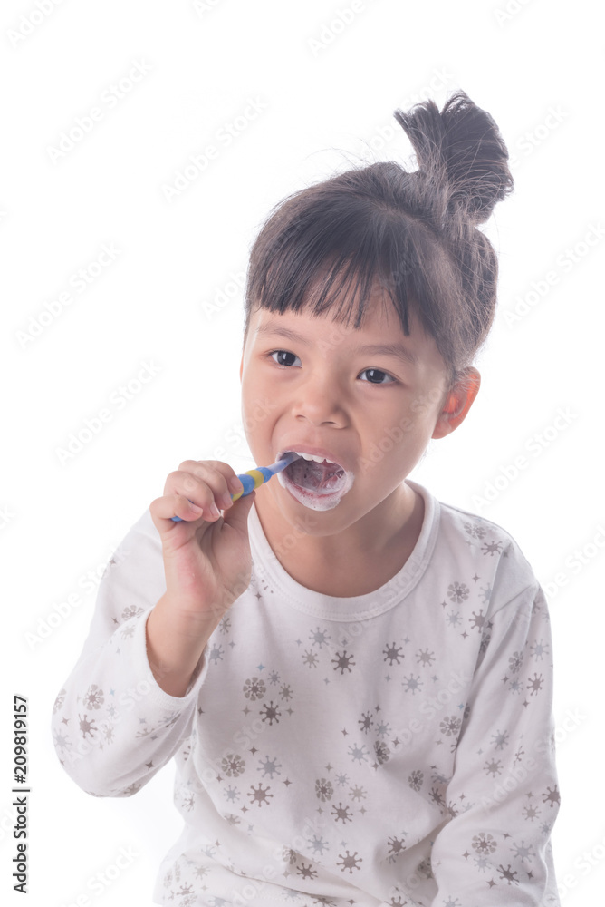Little girl brushing her teeth isolated on white background Little girl brushing her teeth isolated on white background