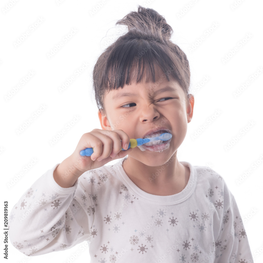 Little girl brushing her teeth isolated on white background Little girl brushing her teeth isolated on white background