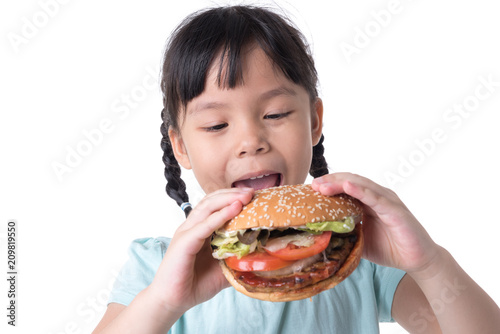 portrait of a beautiful girl  teenager and schoolgirl  holding a hamburger on a white background