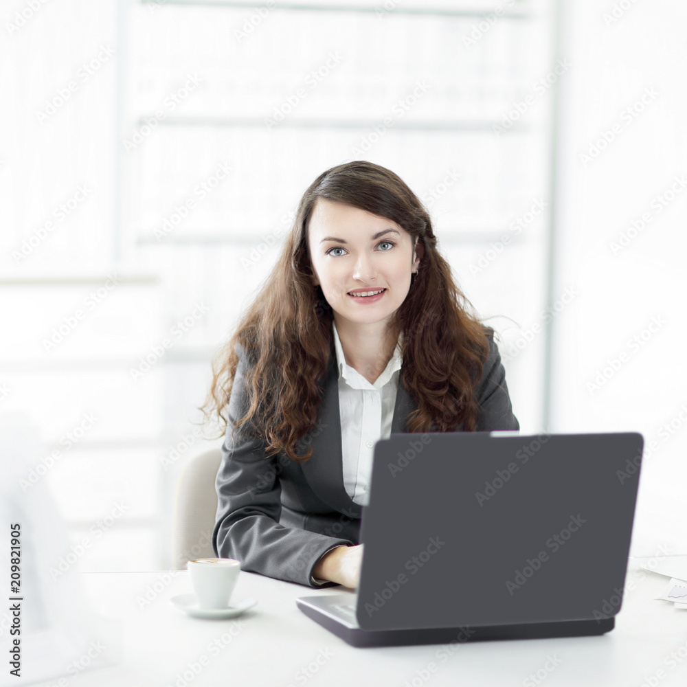 successful business woman sitting at the Desk in the office successful business woman sitting at the Desk in the office
