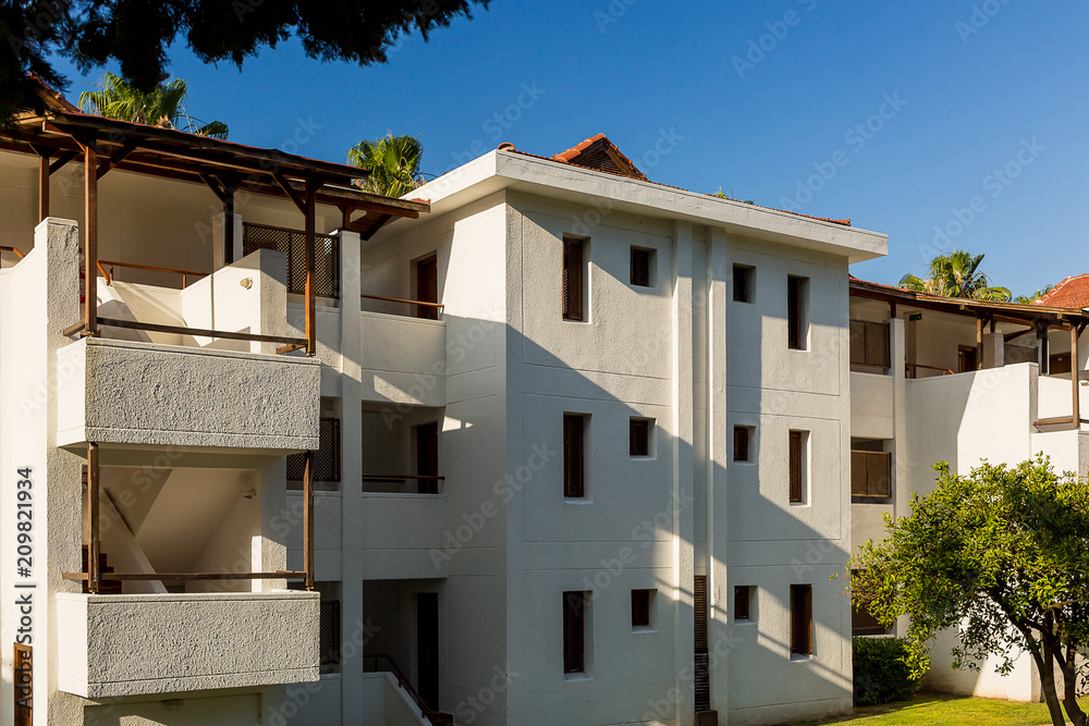 Fototapeta premium The building is a Motel in white color in Kemer. Turkey.