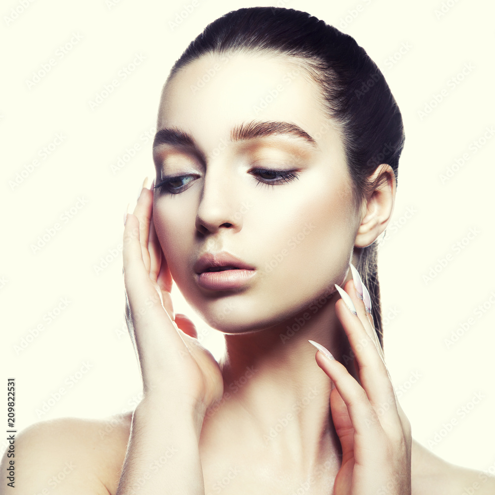 Beauty model girl portrait. Hands touch clean skin, natural make-up, brunette hair. Skincare facial treatment concept Beauty model girl portrait. Hands touch clean skin, natural make-up, brunette hair. Skincare facial treatment concept