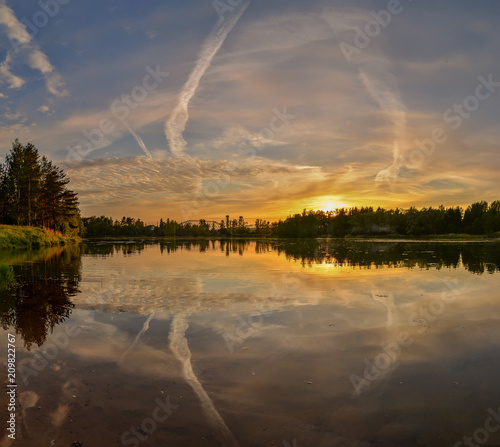 Summer sunset on the Bank of the quarry. The fading light of the sun.