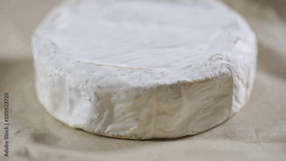 Portion of rotating creamy Camembert as detailed 4k footage Portion of rotating creamy Camembert as detailed 4k footage