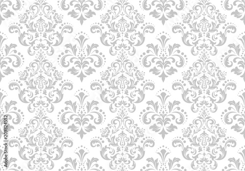 Wallpaper in the style of Baroque. A seamless vector background. White and grey floral ornament. Graphic pattern for fabric, wallpaper, packaging. Ornate Damask flower ornament.
