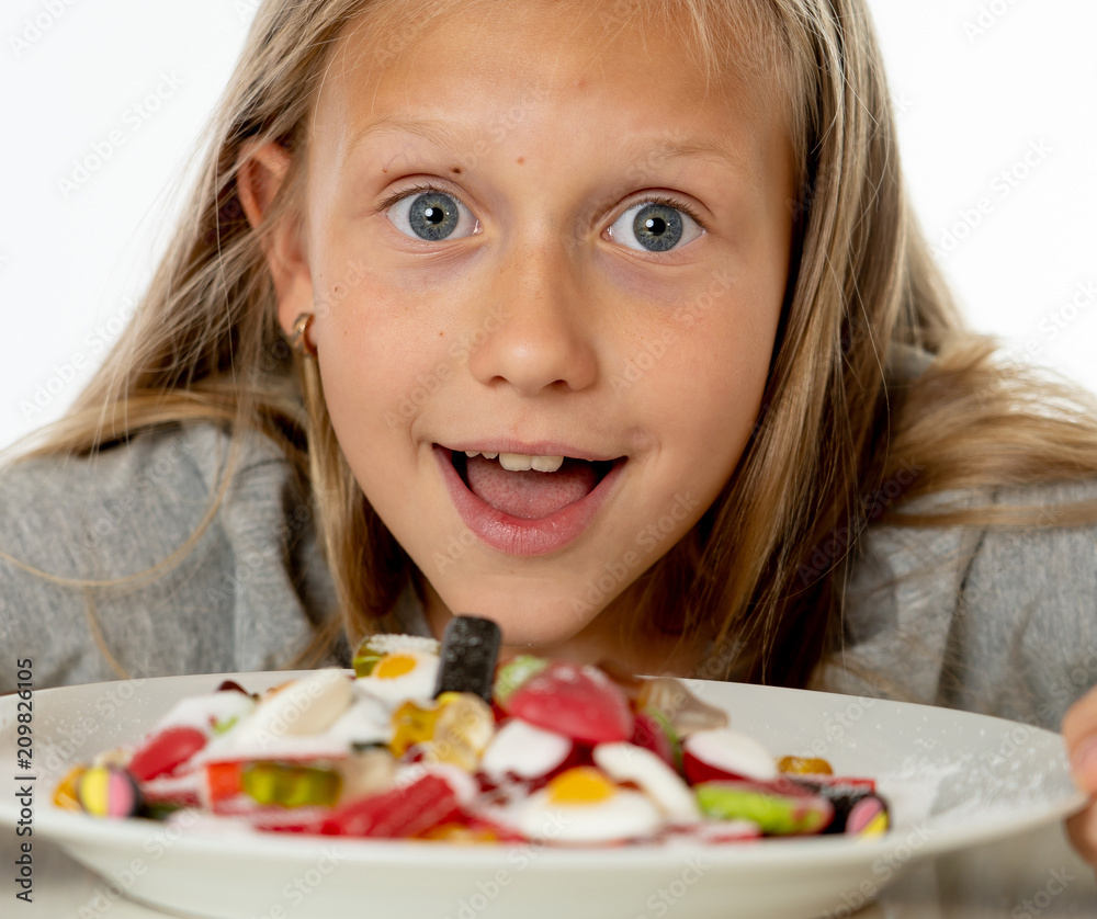 sugar high young blonde girl eating too much sugar in nutrition sugar high young blonde girl eating too much sugar in nutrition