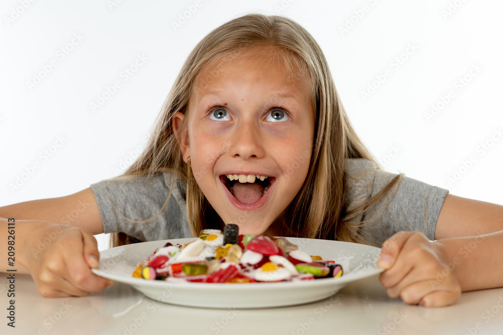 sugar high young blonde girl eating too much sugar in nutrition concept sugar high young blonde girl eating too much sugar in nutrition concept