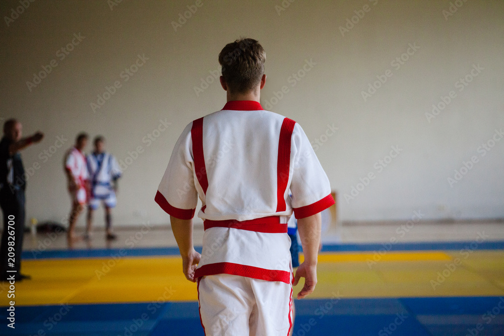 Young athlete kuresh on tatami before the start of the competition Young athlete kuresh on tatami before the start of the competition