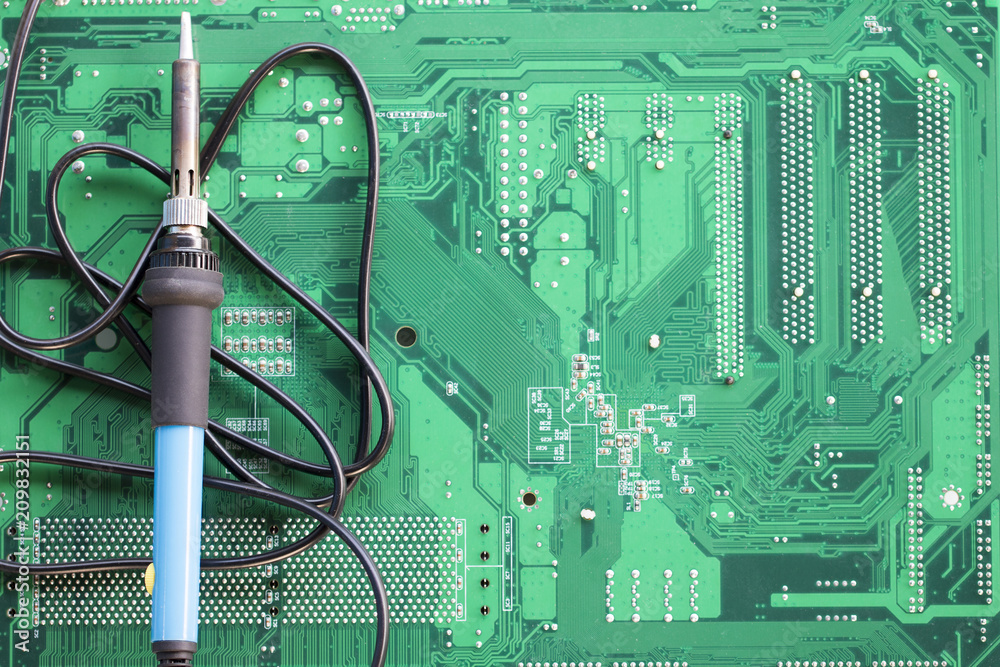 Green circuit board with soldering iron template for text. Repair  Electronics Service. Development Engineering Motherboard background. Deep  sldered repairing of electronic computer equipment. Stock Photo | Adobe  Stock