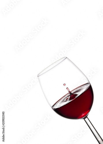 splash of red wine in a glass