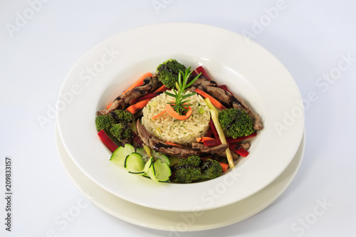 Risotto with vegetables and sliced meat 