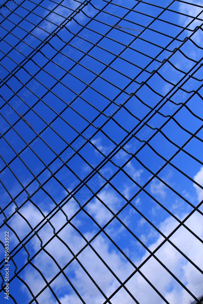 the blue sky behind the basketball lattice the blue sky behind the basketball lattice