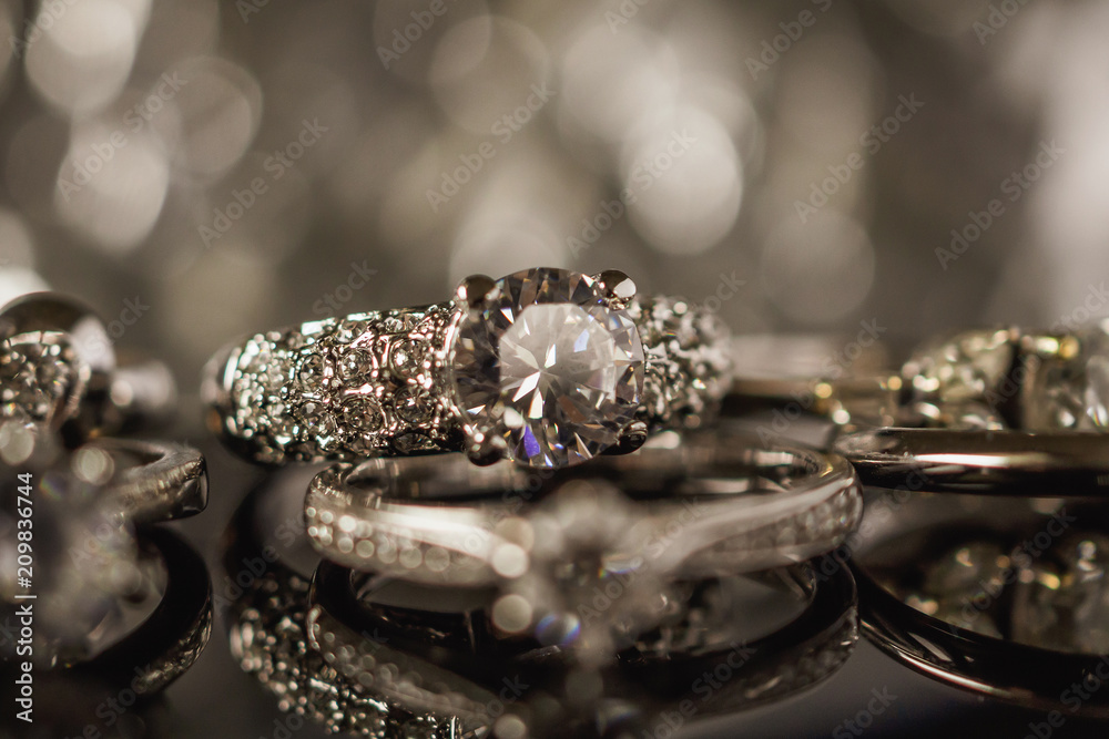 Luxury Jewelry diamond rings with reflection on black background Luxury Jewelry diamond rings with reflection on black background