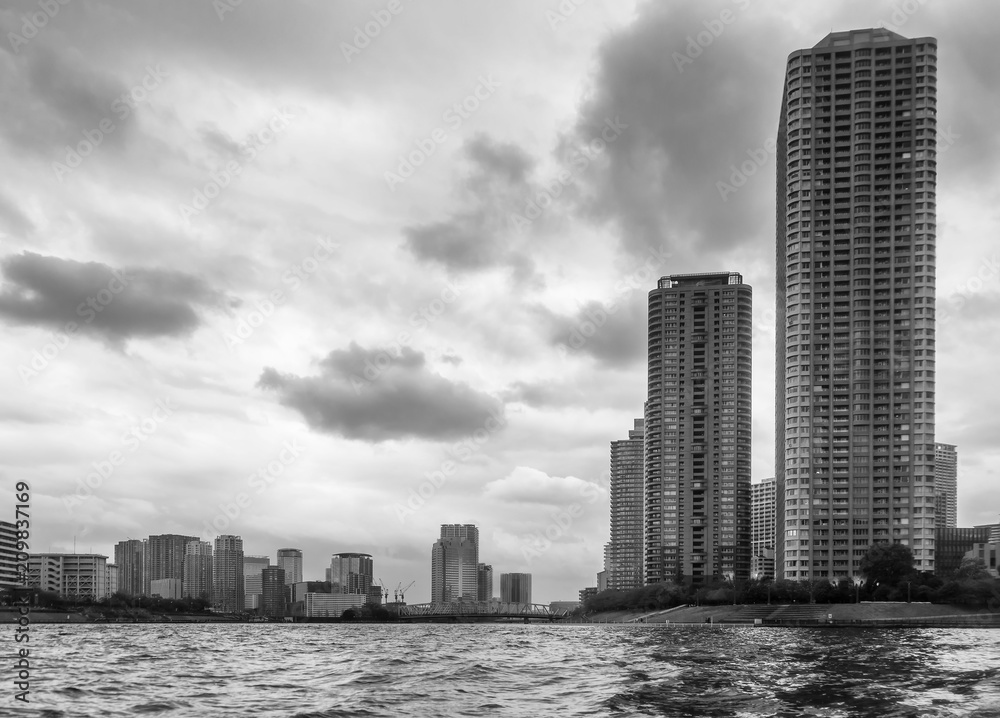 Dramatic sky on the skyscrapers of downtown Tokyo, Japan, seen from the Sumida River