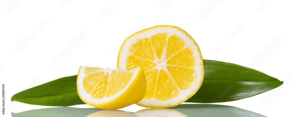 Juicy ripe lemon slices with green leaves isolated on white