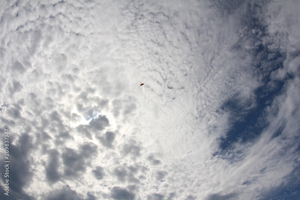 Parachute is flying in the amazing sky.