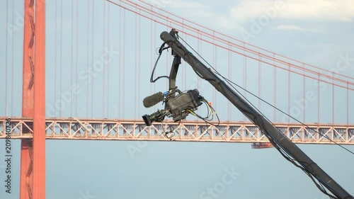 Live event video camera on crane over white