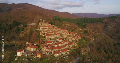 Aerial, beautiful little hamlet on the hill in Tuscany, Italy photo