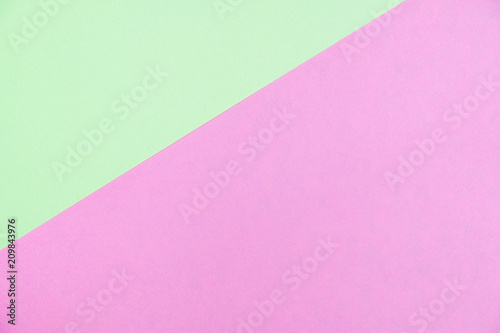 Pastel colored paper flat lay top view, background texture, green and pink