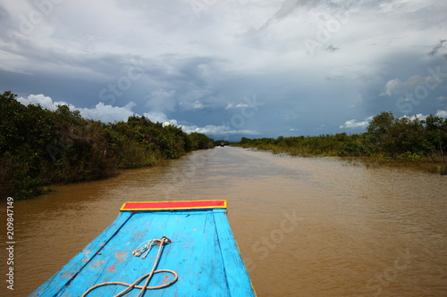View from the front of a boat on a river