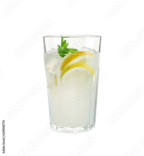 Glass with natural lemonade on white background