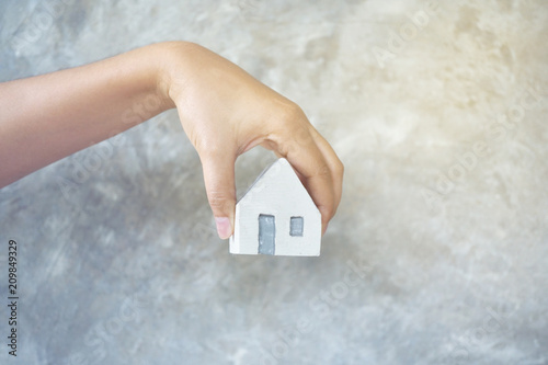 House in hand close-up.on bright background