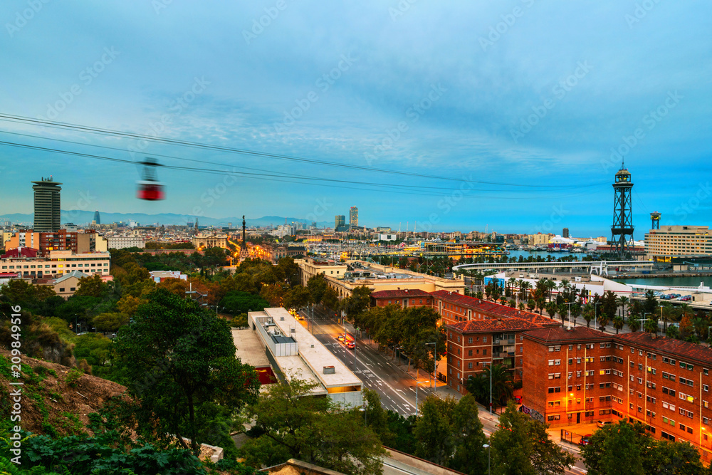 Aerial view of Barcelona, Spain port with sea and colorful sunset cloudy sky