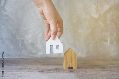House in hand close-up.on bright background