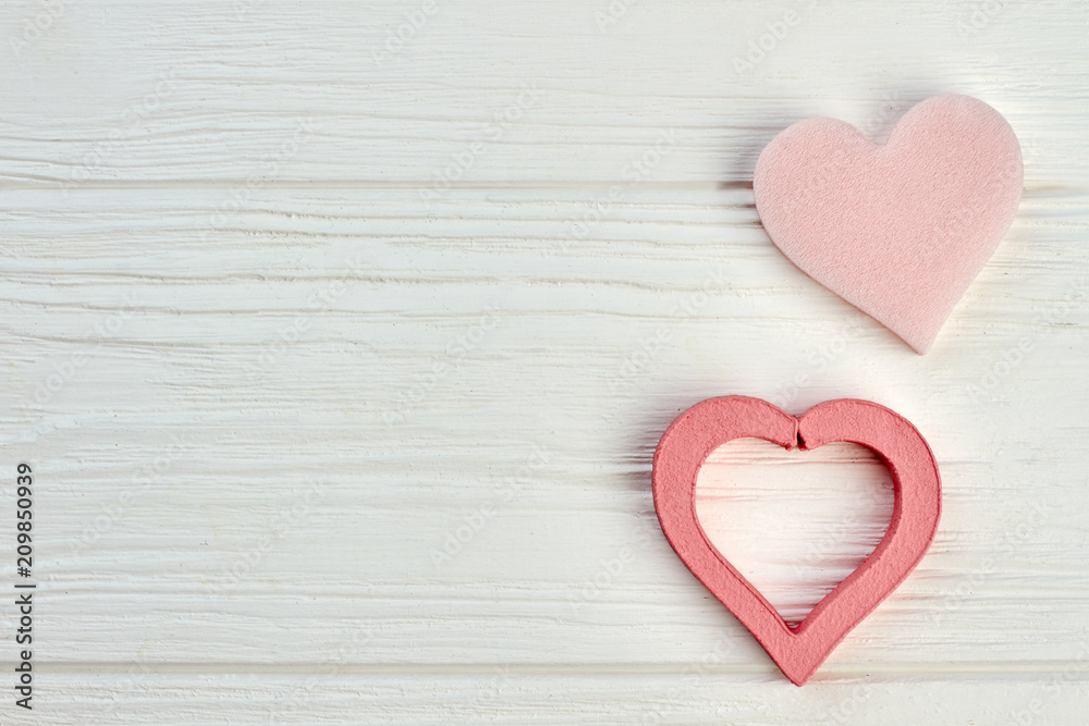 Happy Valentines Day wooden background. Two decorative hearts and copy space. Happy Valentines holiday. Happy Valentines Day wooden background. Two decorative hearts and copy space. Happy Valentines holiday.