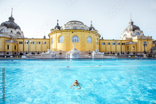 Photography Woman relaxing at the famous Szechenyi thermal bathes in Budapest, Hungary