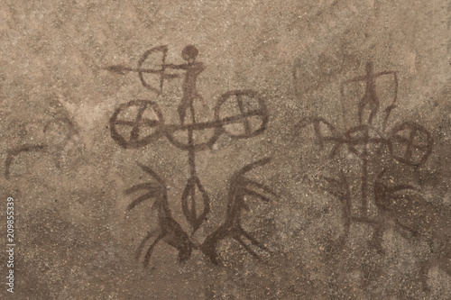 A drawing depicting the hunt of ancient people depicted on the wall of the cave. ancient history.