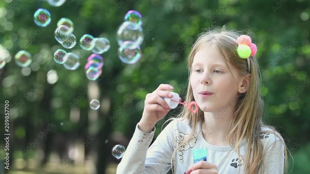 summer fun. Girl with soap bubble. slow motion summer fun. Girl with soap bubble. slow motion