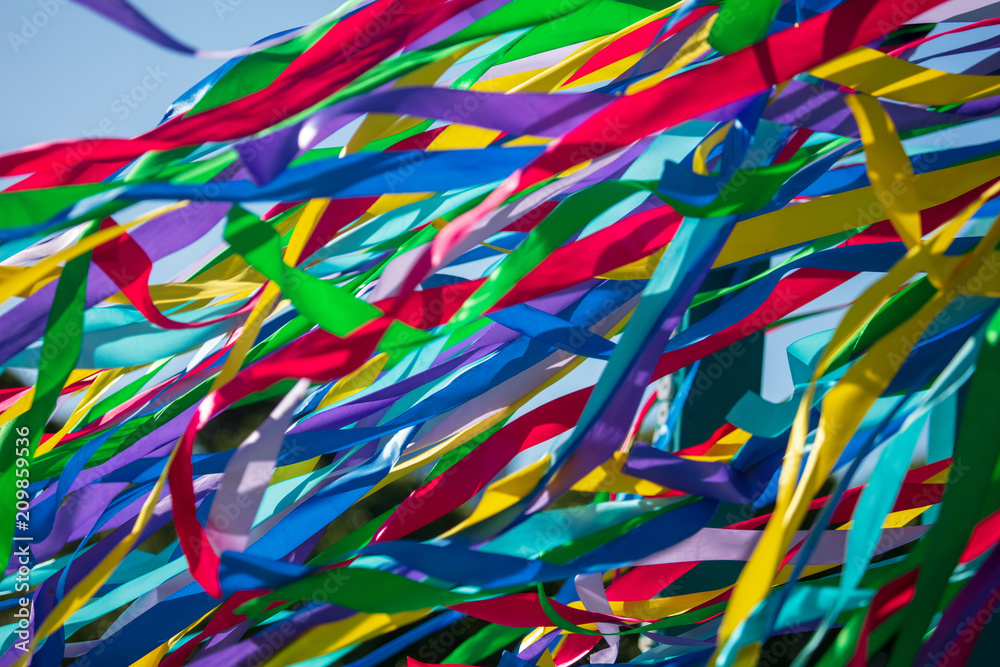 Multicolored ribbons on holiday as an abstract background