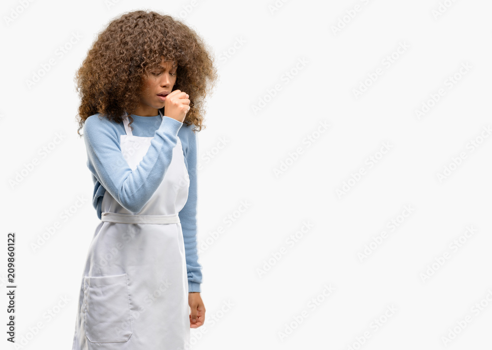 African american shop owner woman wearing an apron sick and coughing, suffering asthma or bronchitis, medicine concept African american shop owner woman wearing an apron sick and coughing, suffering asthma or bronchitis, medicine concept