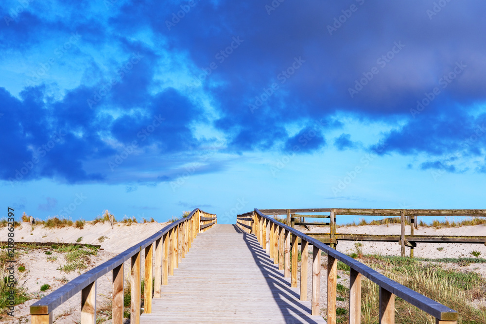 Wooden walkway to the sea at costa nova in Portugal