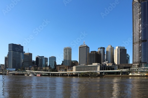 Motorway over the Brisbane river in front of modern skyscrapers