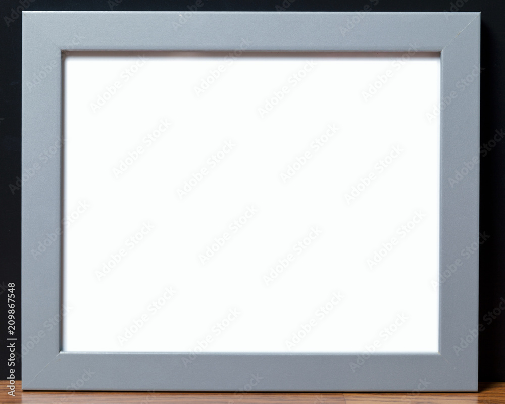 A grey horizontal frame against a dark background. A grey horizontal frame against a dark background.