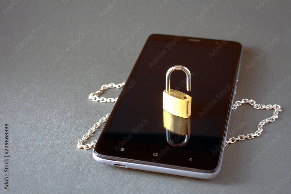 smartphone with unlock padlock chain on a gray background. Concept of mobile phone security forgot password smartphone with unlock padlock chain on a gray background. Concept of mobile phone security forgot password
