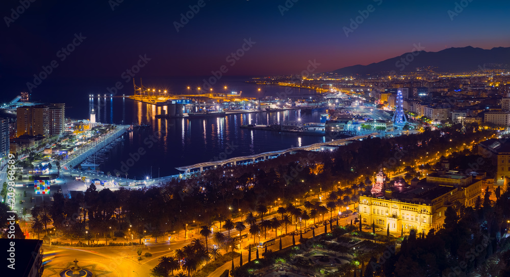 Obraz premium Malaga city with seafront and harbor in the night