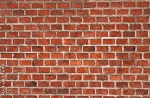 Orange brick wall made of brick and cement. Brick wall texture background