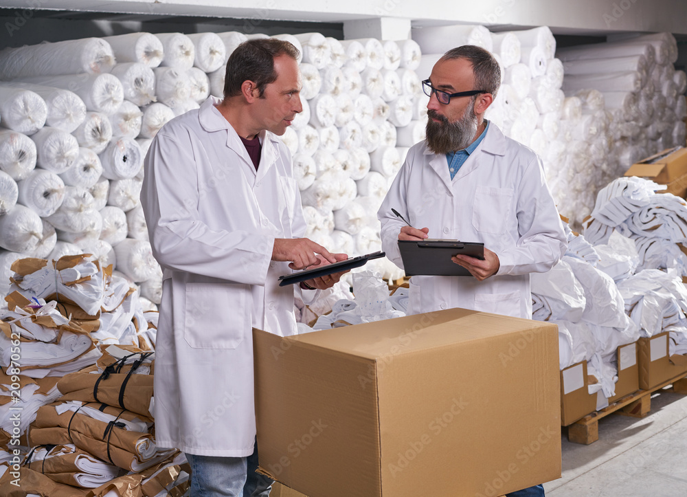 warehouse supervisor and manager men with textile warehouse supervisor and manager men with textile