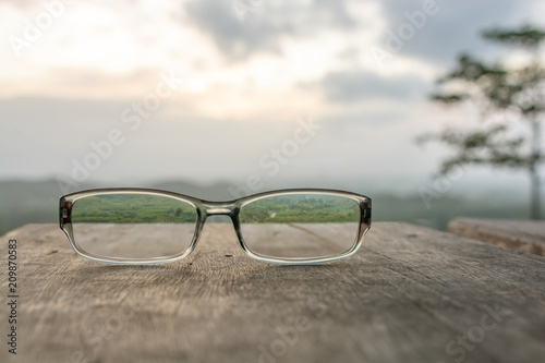 Eyeglasses on wooden table