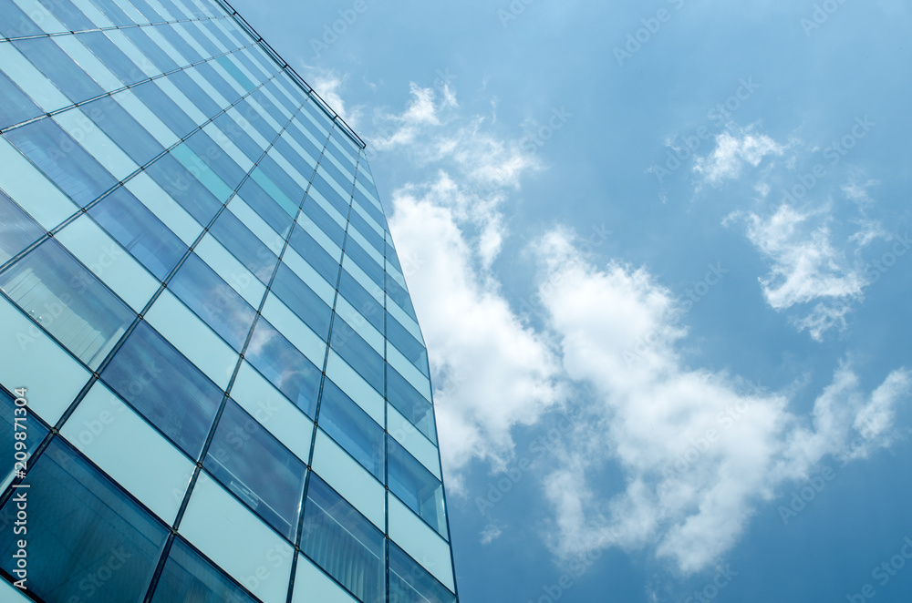 Blue glass wall of skycrapper. Urban abstract background