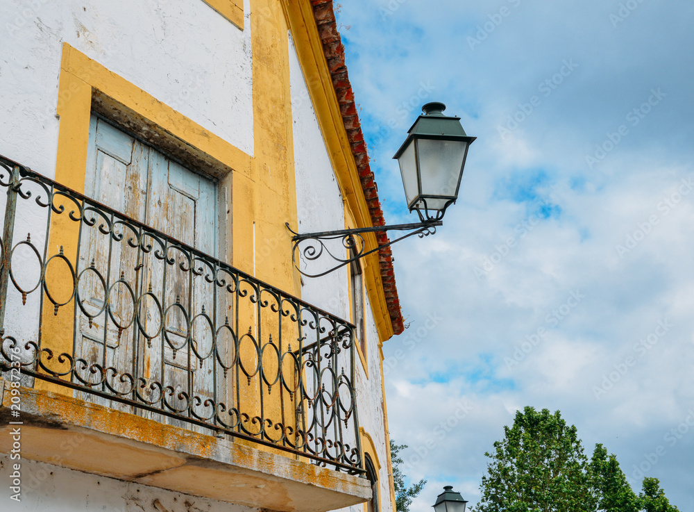 Rustic lamp post and balcony in Portugal