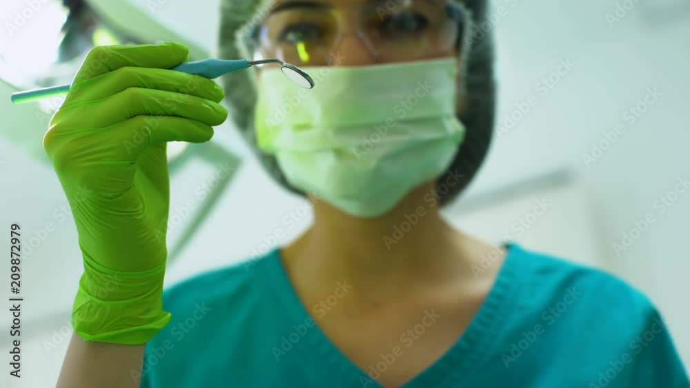 Stomatologist checking patient oral cavity, dental emergency, professionalism
