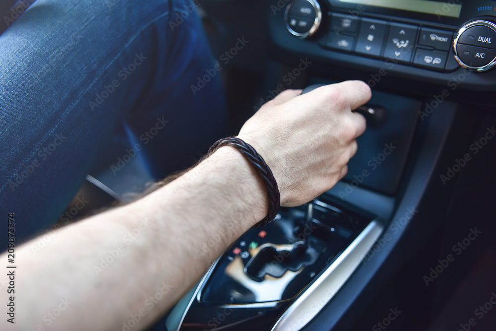 Hand Holding Automatic Transmission In Car