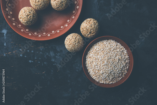 Amaranth or rajgira lahi in a bowl with sweet laddu. selective focus
 photo