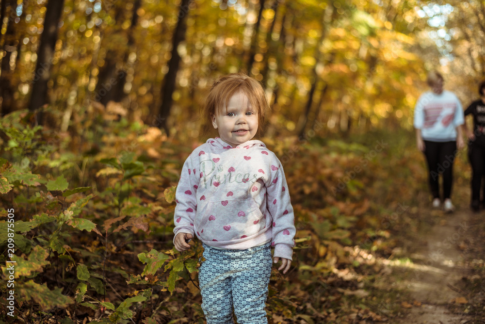 happy little child, baby girl laughing and playing in autumn park happy little child, baby girl laughing and playing in autumn park