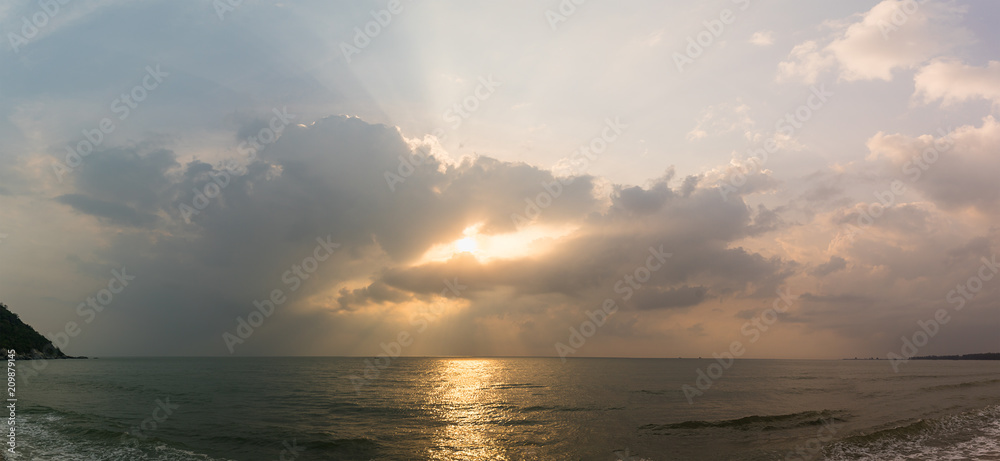 Sunset with dramatic cloud over sea