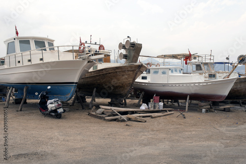 Wooden boats in the shipyard on the lift in Bodrum, Turkey